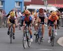 (Click for larger image) Riders in the junior criterium  leave the home straight in Burnie.