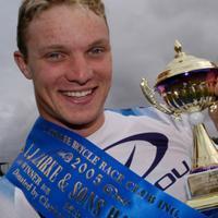 (Click for larger image) Adrian Hanson  shows off his trophy from the A.J.Clarke & Sons final.