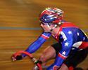 (Click for larger image) USA's Jame Carney  takes a look over his shoulder before flying away to victory in the thrilling 40 lap Gunns Limited A Grade Scratch Race.