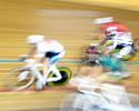 (Click for larger image) A group of riders  become a blur of colour as they round the banking.