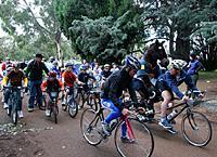 (Click for larger image) Michael Rogers and Stephen Hodge  lead out the kids' race, with Hodgey taking on some fluffy company.