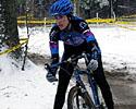 (Click for larger image) Christine Vardaros (Velo Bella) tries the snowy turns this california rider racing in snow the first time this season