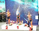 (Click for larger image) The place getters let loose on the podium