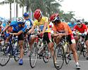 (Click for larger image) Leaders of each competition at the start: Best Asian Rider in the blue jersey, race leader in the yellow jersey, points leader in the orange jersey.