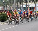 (Click for larger image) Points leader Kam Po Wong (orange jersey) and race leader Kin San Wu (yellow jersey) lead the race