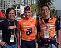 (Click for larger image) Points leader Joe Papp (Champion System) poses with two of the owners of Champion System Custom Cyclewear (www.champ-sys.com), the official leader's jersey of the Tour of South China Sea.