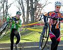 (Click for larger image) Race winner Mackenzie Dickey (Team Bicycle Alley) leads Mo Bruno (Independant Fabrications) through the barriers
