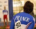 (Click for larger image) Clara Sanchez (France) watches a male teammate receive his medal