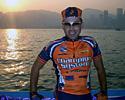 (Click for larger image) Joe Papp with the island of Hong Kong in the background before the start of stage 1 of the Tour of the South China Sea