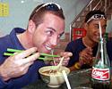 (Click for larger image) Joe Papp and Daniel Lee enjoy a joke during lunch in Macau.