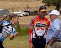 (Click for larger image) Wes Sulzberger (Cyclingnews.com, L)  and Henk Vogels (Davitamon Lotto), explain the final kilometres of the race to the President of Cycling Australia, Mike Victor.