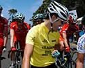 (Click for larger image) Greg Henderson gives the thumbs up to his Drapac-Porsche Cycling team-mates behind him after taking the series leader's yellow jersey on day one