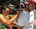 (Click for larger image) Robbie McEwen signs one of many autographs for Amy's Ride participants