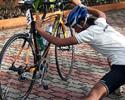 (Click for larger image) Putrajaya rider Naim Aziz stretching hard before the race