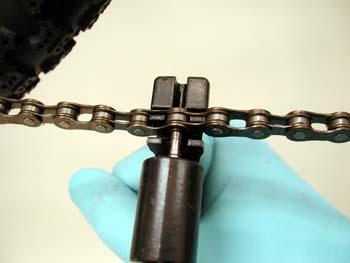 Chain held for rivet removal