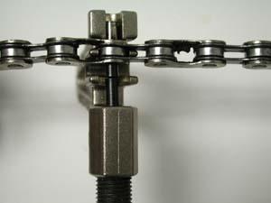 Use replacement rivet to push out original rivet
