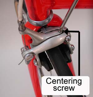 Centering screw at top of caliper brace